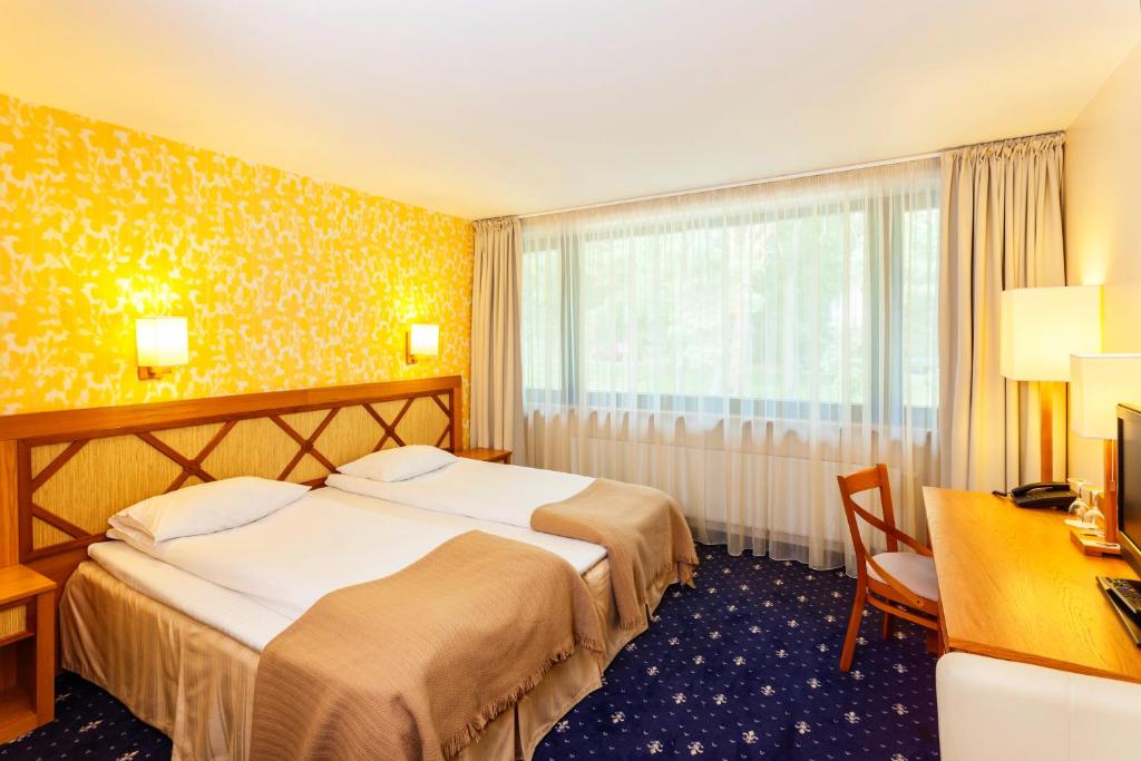 Postel nebo postele na pokoji v ubytování Park Villa Hotel