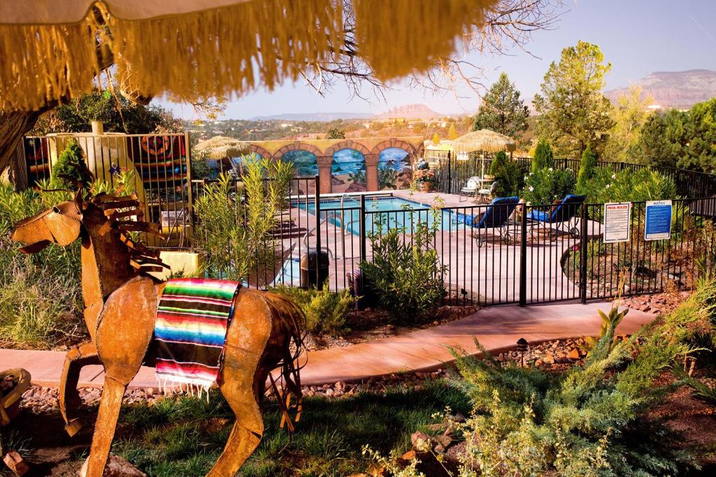 a statue of a horse next to a pool at A Sunset Chateau in Sedona