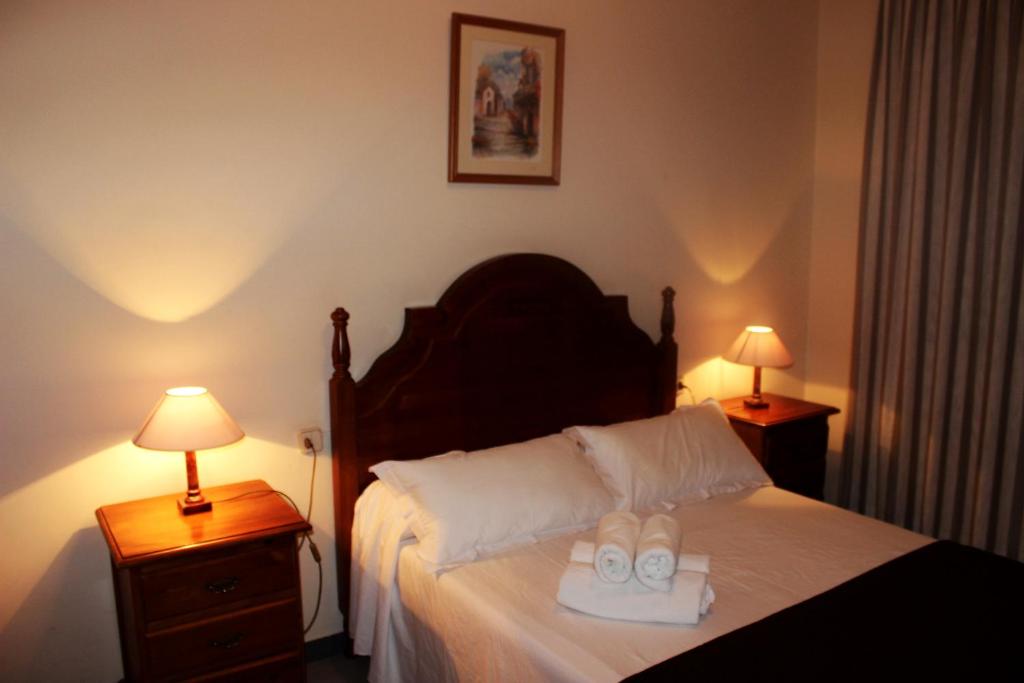 Postel nebo postele na pokoji v ubytování Hostal Los Maños