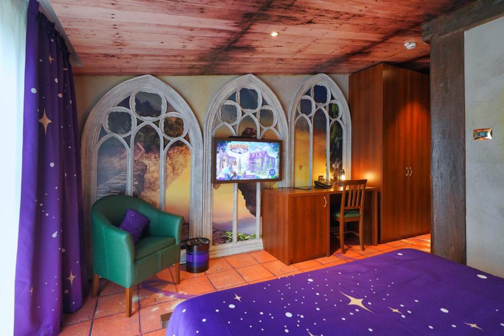 Postel nebo postele na pokoji v ubytování Gardaland Magic Hotel