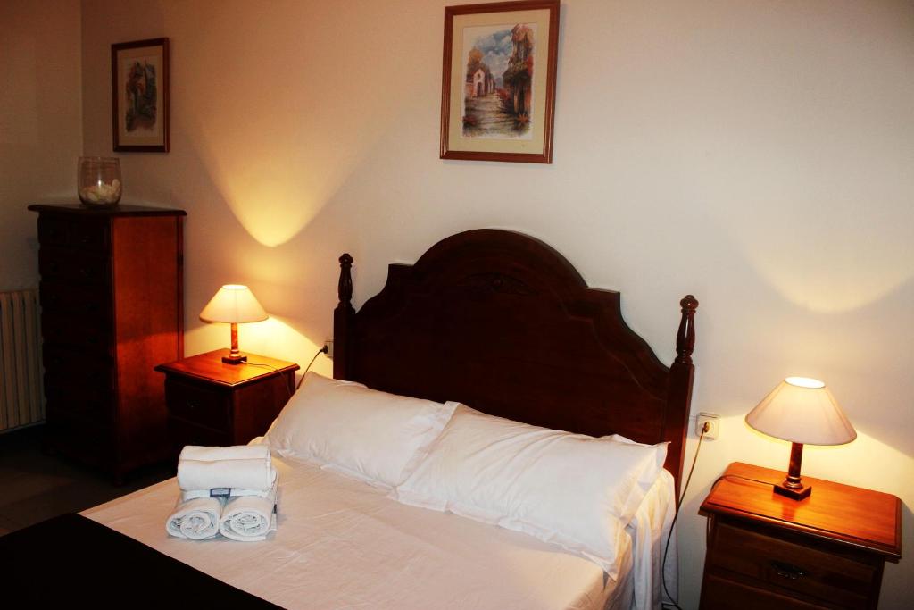 Postel nebo postele na pokoji v ubytování Hostal Los Maños