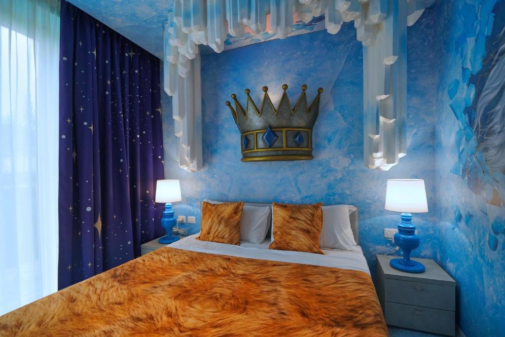Postel nebo postele na pokoji v ubytování Gardaland Magic Hotel