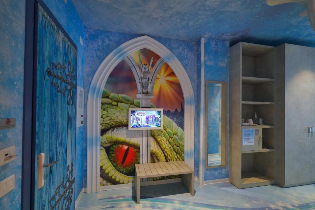 TV a/nebo společenská místnost v ubytování Gardaland Magic Hotel