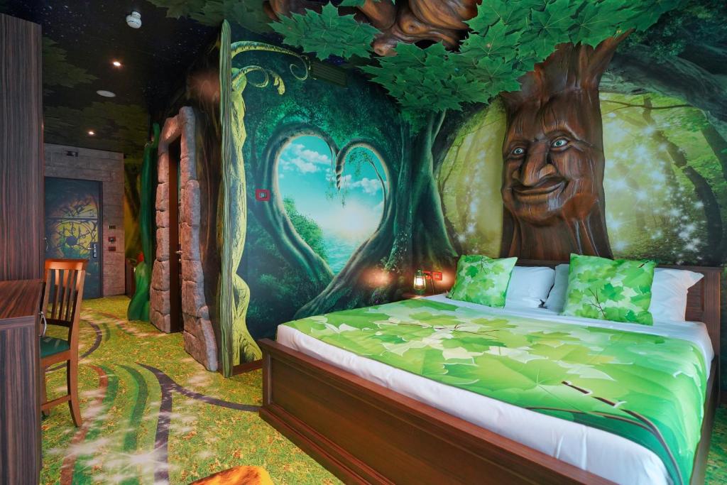 Postel nebo postele na pokoji v ubytování Gardaland Magic Hotel