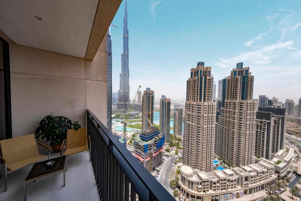 a balcony with a view of a city at Fantastay - Towering Burj Khalifa view - BLVD Crescent Tower in Dubai