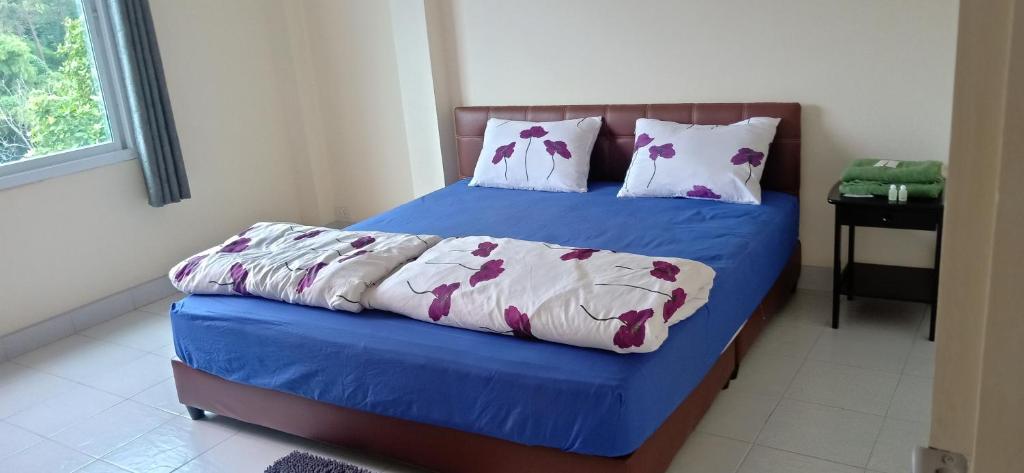 Postel nebo postele na pokoji v ubytování DoiTung Homestay ดอยตุงโฮมสเตย์