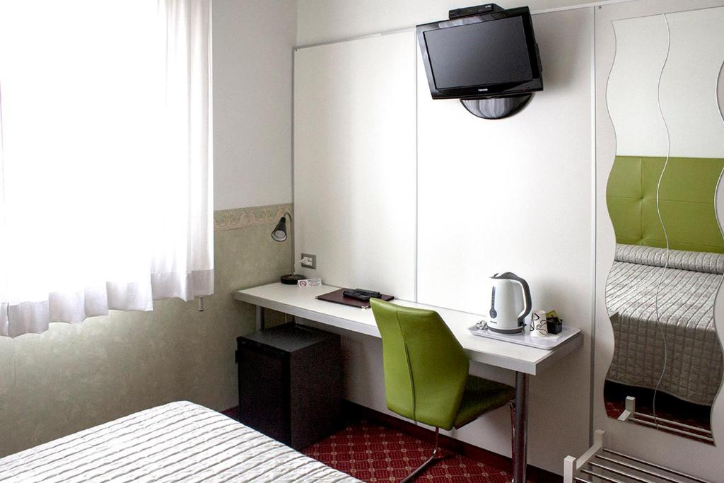 Posteľ alebo postele v izbe v ubytovaní Albergo Ristorante Belvedere