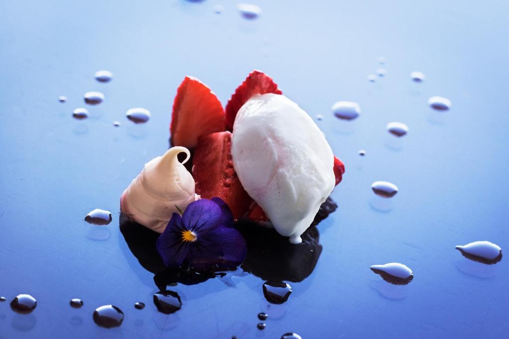 a piece of ice cream sitting on top of water at Eurostars Torre Sevilla in Seville
