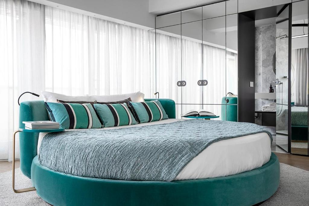 Postel nebo postele na pokoji v ubytování Hotel Plaza e de Russie - Relais & Châteaux