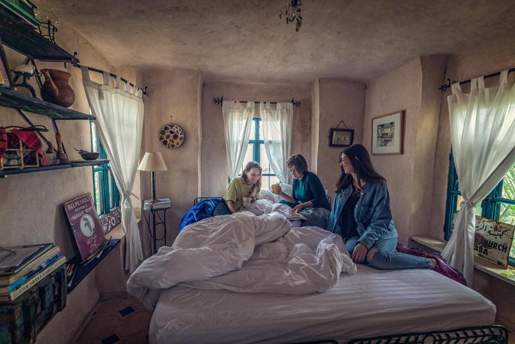 Postel nebo postele na pokoji v ubytování Beit Al Fannan