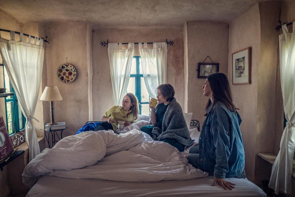 Postel nebo postele na pokoji v ubytování Beit Al Fannan