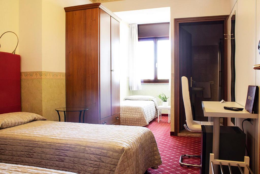 Posteľ alebo postele v izbe v ubytovaní Albergo Ristorante Belvedere