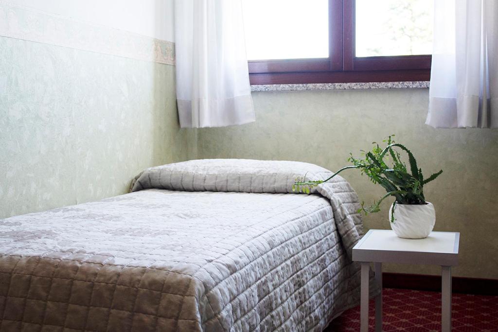 Posteľ alebo postele v izbe v ubytovaní Albergo Ristorante Belvedere