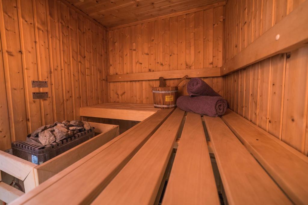 a wooden interior of a sauna with a bench at Horizon Blu Boutique Hotel in Kalamata