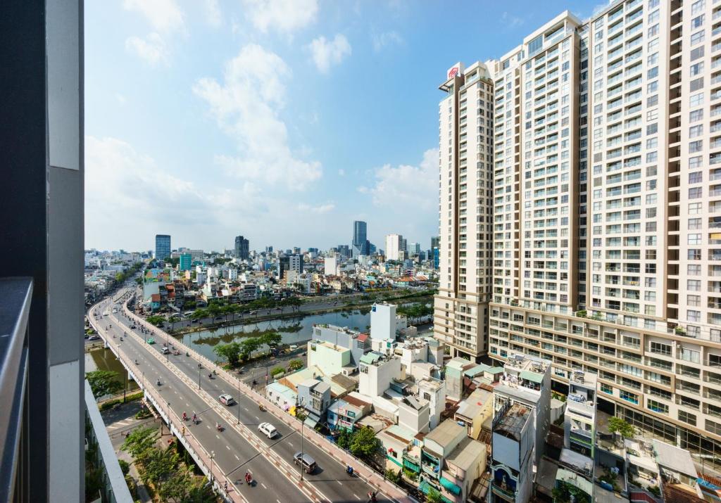an aerial view of a city with a large building at RiverGate Residence in Ho Chi Minh City