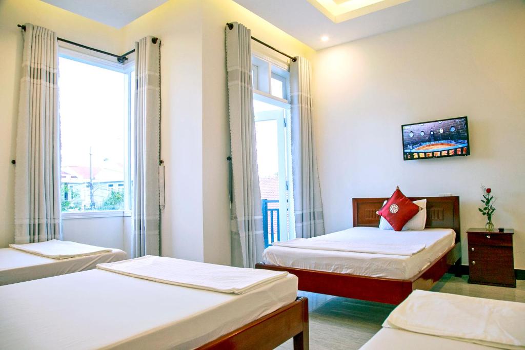 Postel nebo postele na pokoji v ubytování Basil Homestay