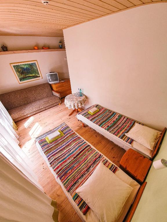Postel nebo postele na pokoji v ubytování Mazā Kāpa