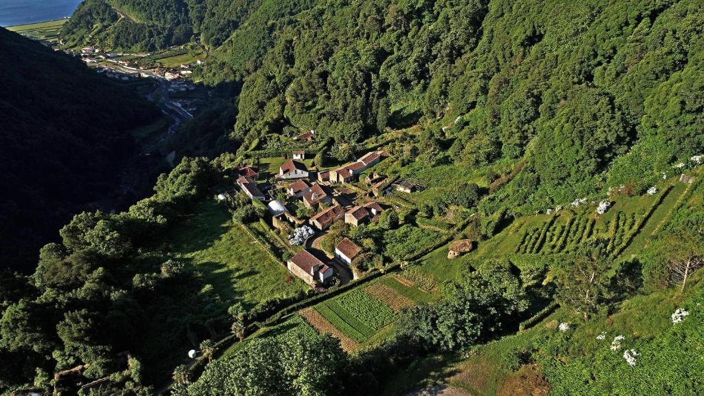 an aerial view of a farm on a mountain at Aldeia do Sanguinho in Faial da Terra