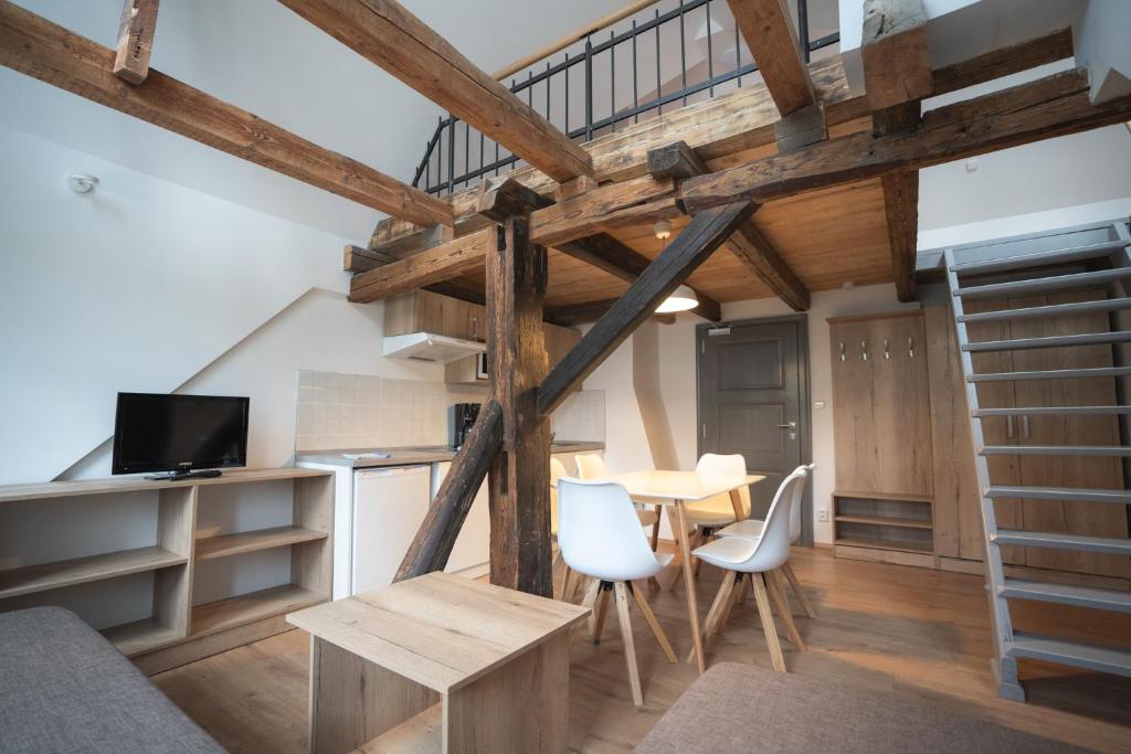 Televízia a/alebo spoločenská miestnosť v ubytovaní Apartmány Jurica Boží Dar 88