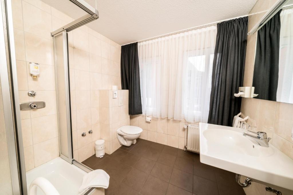 Koupelna v ubytování Parkhotel Lingen by Hackmann