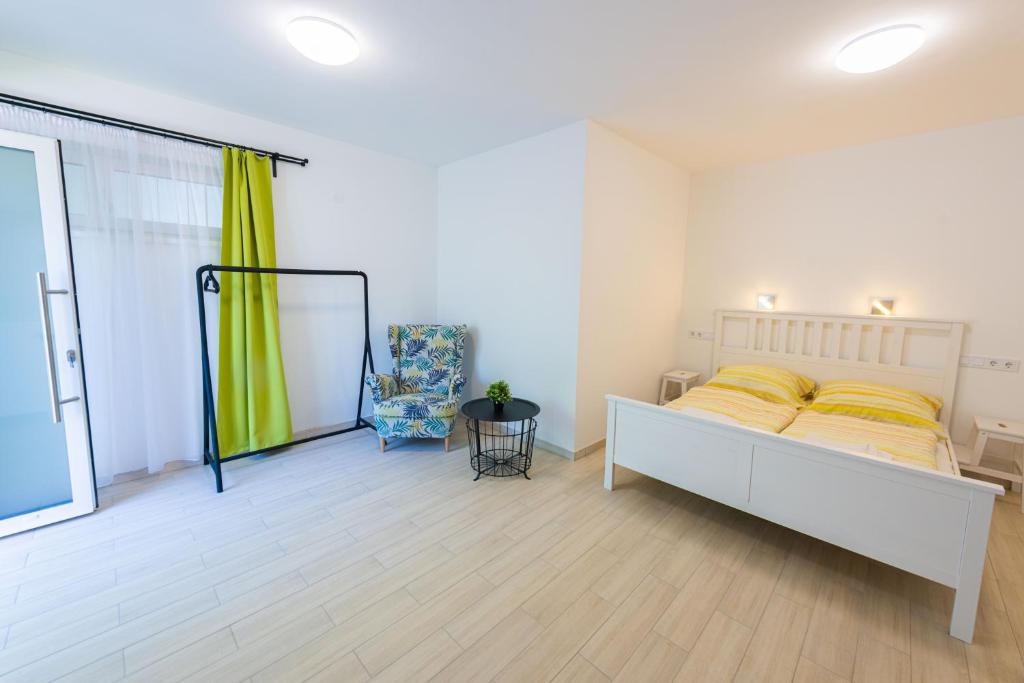 Postel nebo postele na pokoji v ubytování Hullam Rooms Siofok