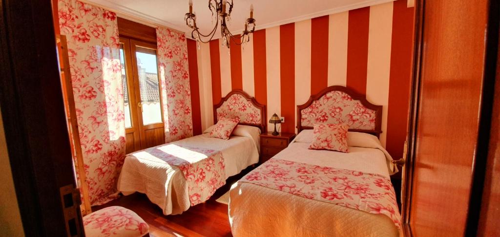 Postel nebo postele na pokoji v ubytování La Casa de Begoña