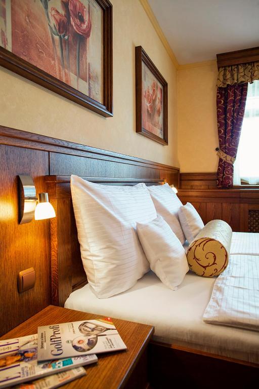 Postel nebo postele na pokoji v ubytování Hotel Abácie & Wellness