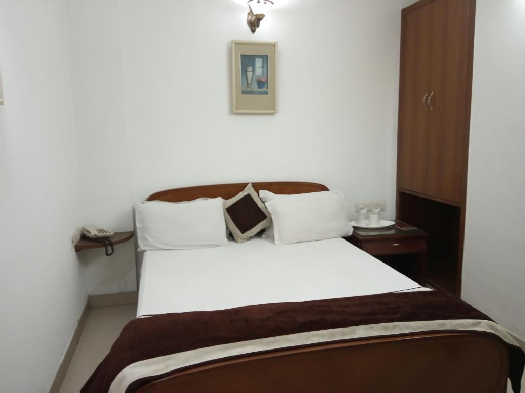 Postel nebo postele na pokoji v ubytování Solo Victoria Hotel