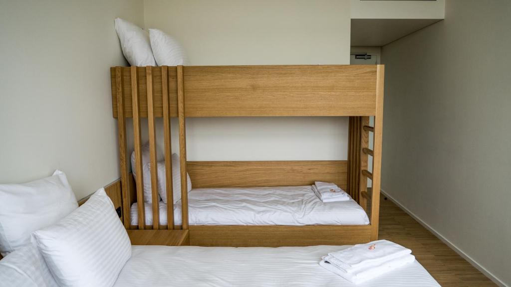 Postel nebo postele na pokoji v ubytování Hotond Sporthotel