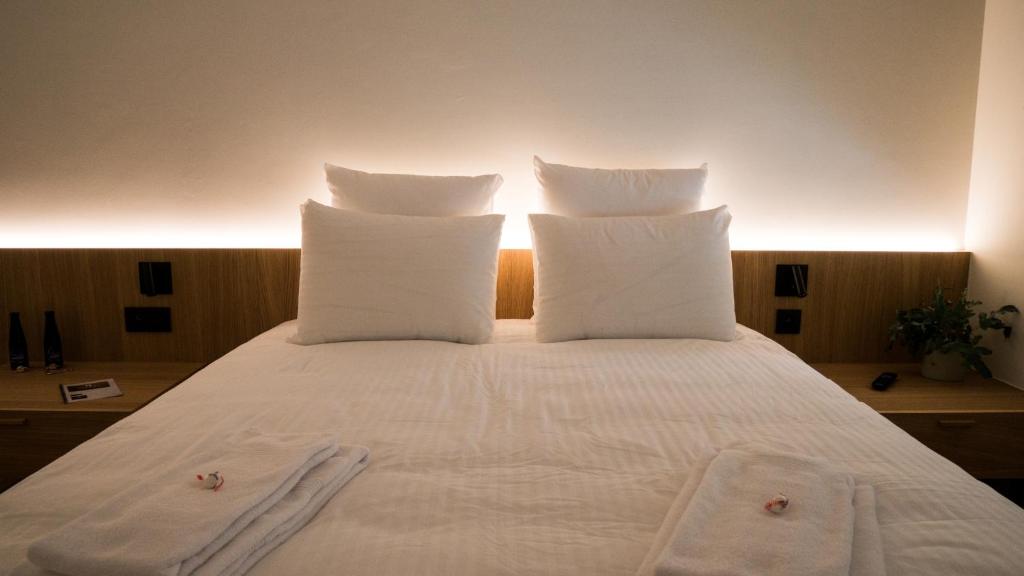Postel nebo postele na pokoji v ubytování Hotond Sporthotel