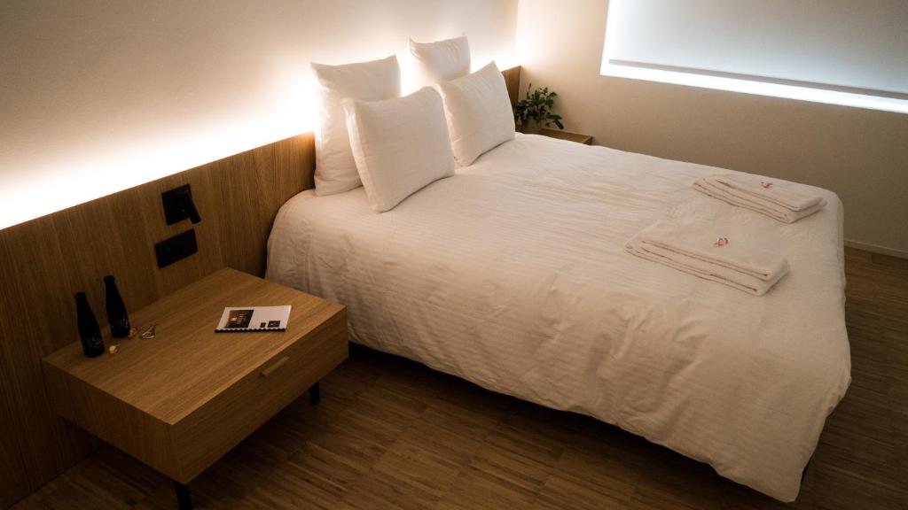 Postel nebo postele na pokoji v ubytování Hotond Sporthotel