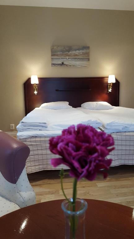 Postel nebo postele na pokoji v ubytování Dagsholm Hotell
