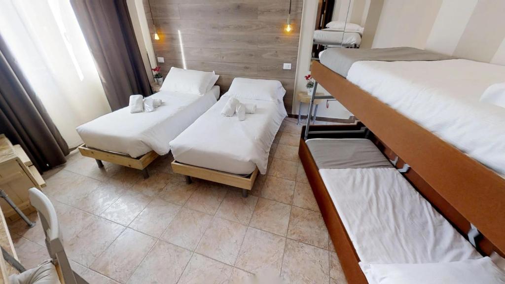 Posteľ alebo postele v izbe v ubytovaní Hotel Raphael