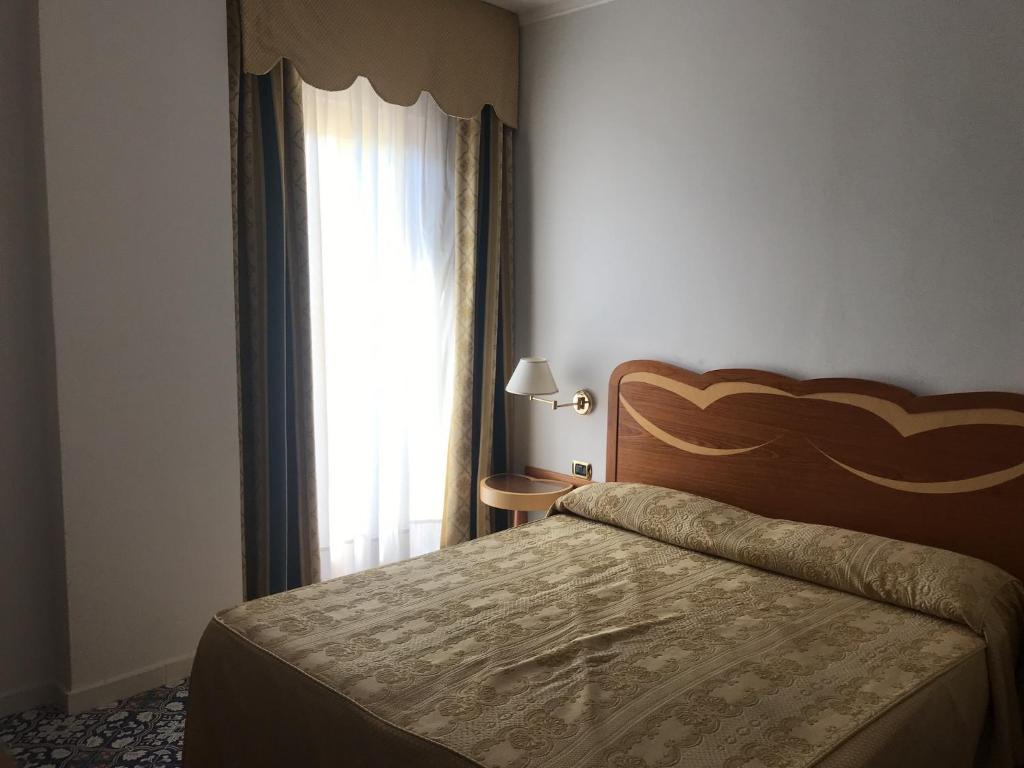 Postel nebo postele na pokoji v ubytování Hotel Albatros