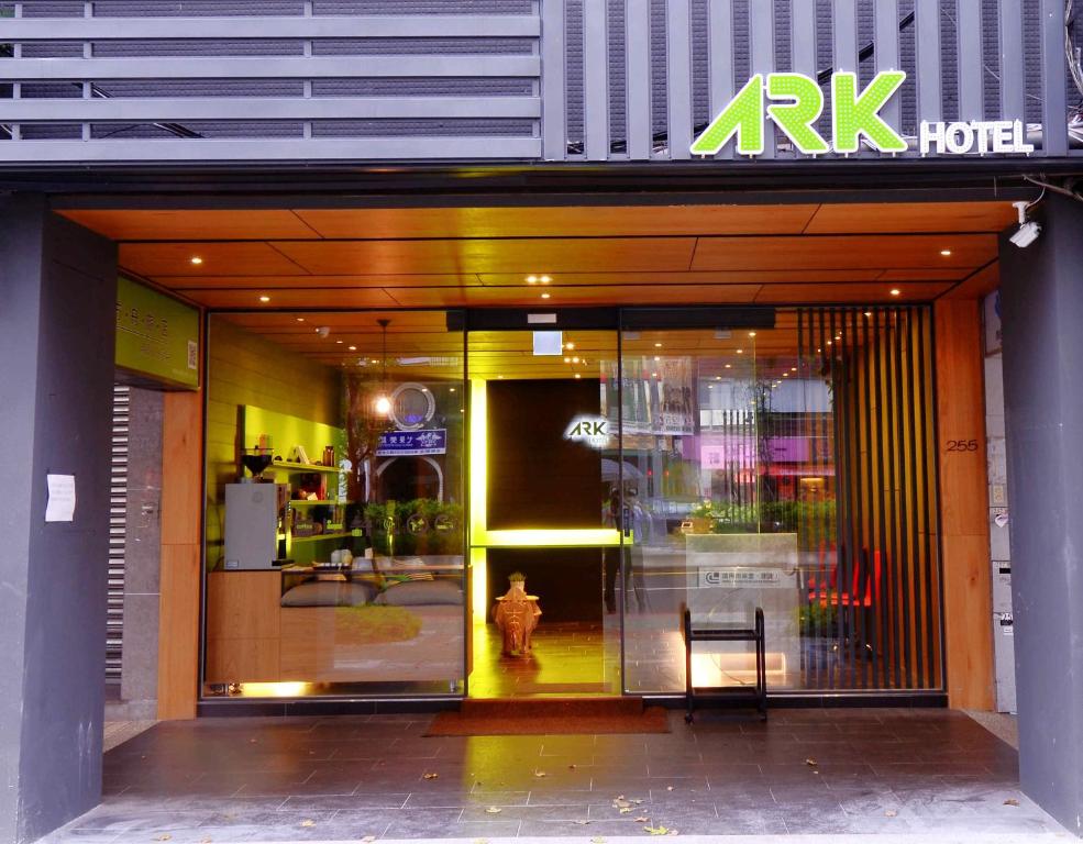 a store front with a glass door with a fire hydrant at ARK Hotel - Dongmen in Taipei