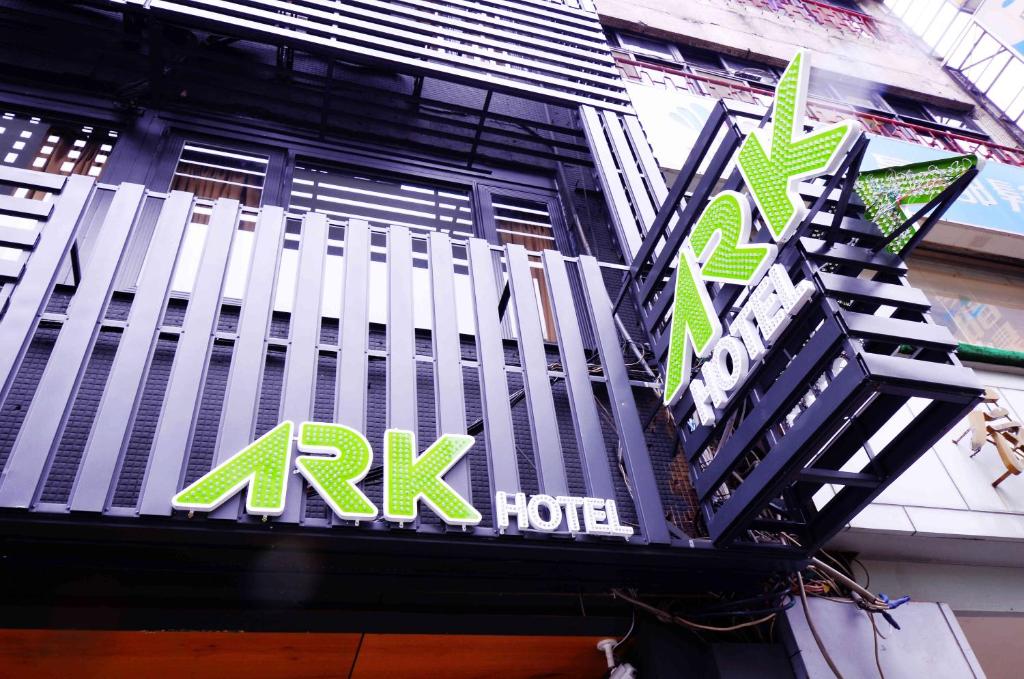 a sign for a kirk hotel on the side of a building at ARK Hotel - Dongmen in Taipei