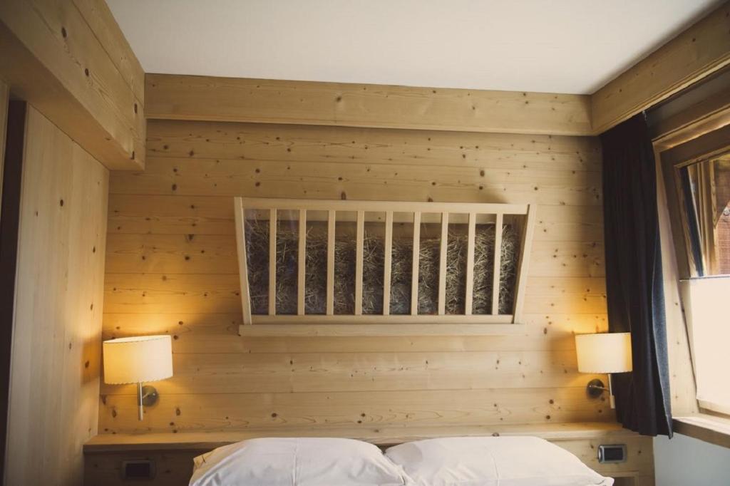 Postel nebo postele na pokoji v ubytování Alpen Hotel Chalet