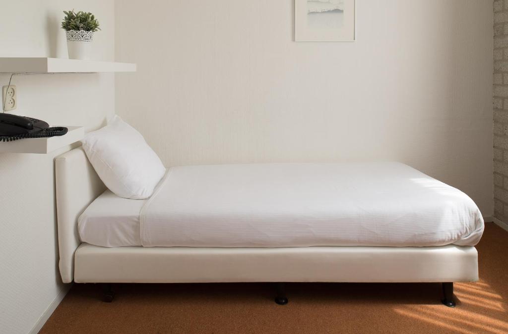 Postel nebo postele na pokoji v ubytování Parkhotel De Bosrand