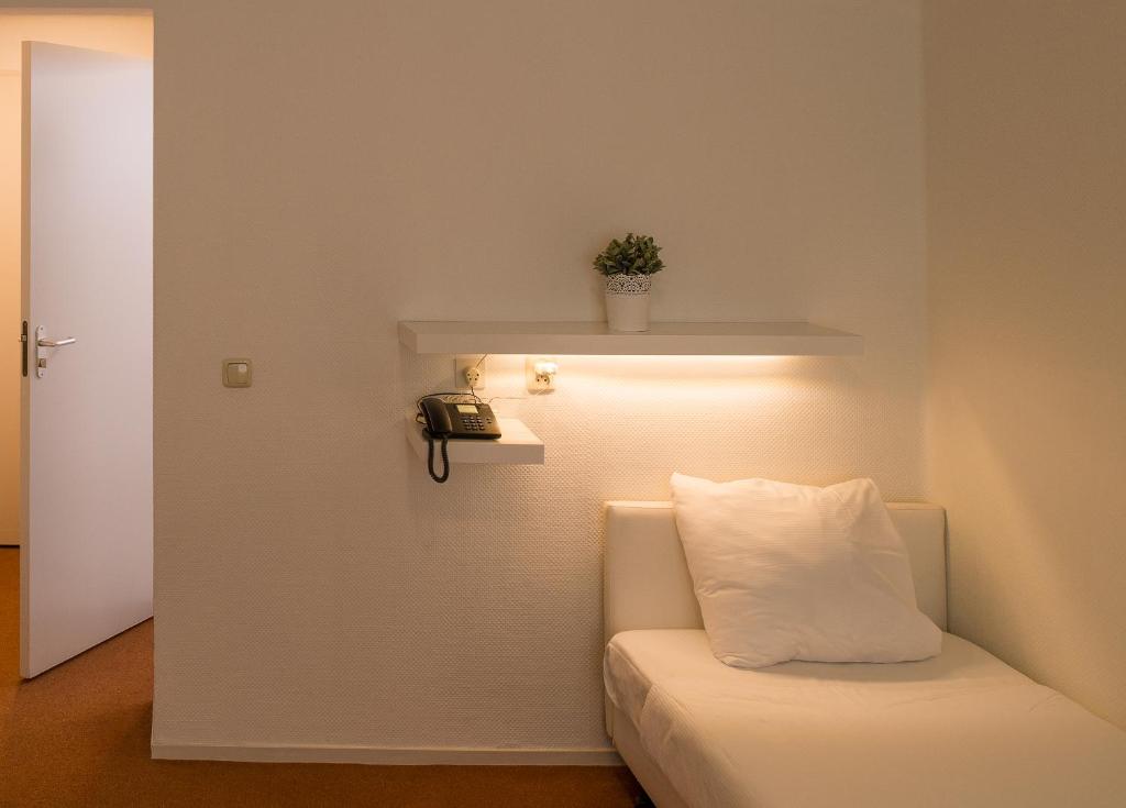 Postel nebo postele na pokoji v ubytování Parkhotel De Bosrand
