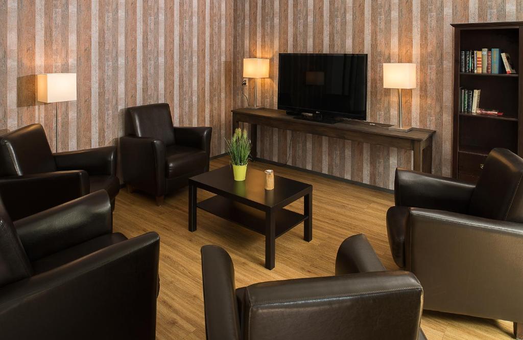 TV a/nebo společenská místnost v ubytování Parkhotel De Bosrand