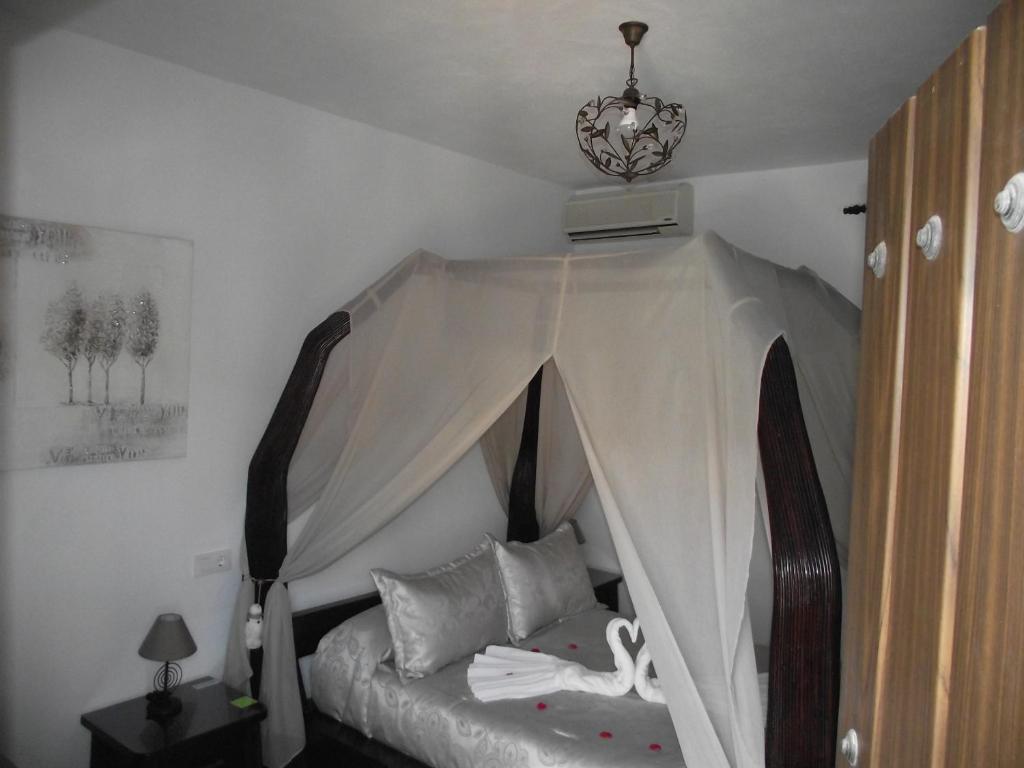 Cama o camas de una habitación en Hostal El Canario