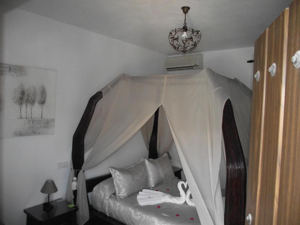 Postel nebo postele na pokoji v ubytování Hostal El Canario