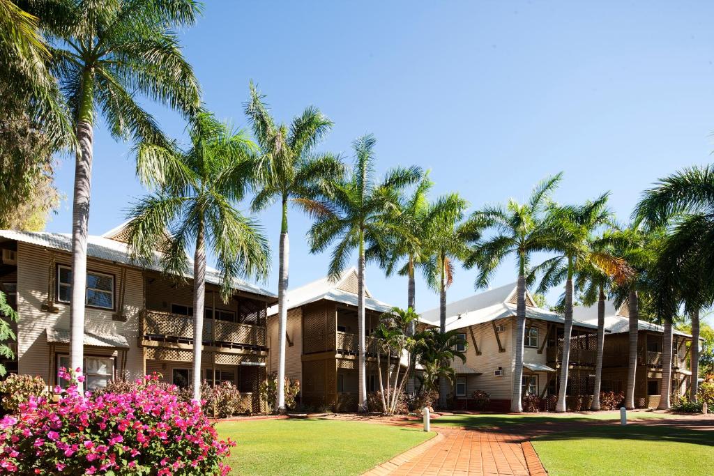 a view of the front of the resort with palm trees at Seashells Broome in Broome