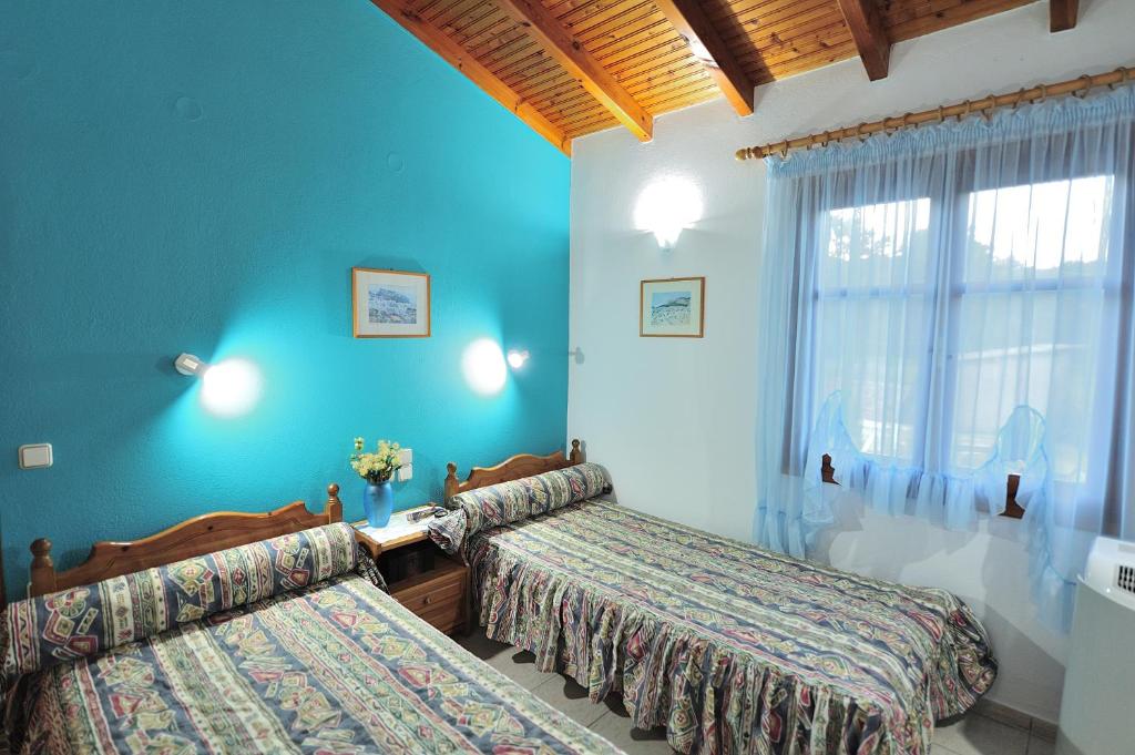 Postel nebo postele na pokoji v ubytování Anastazia Paradise