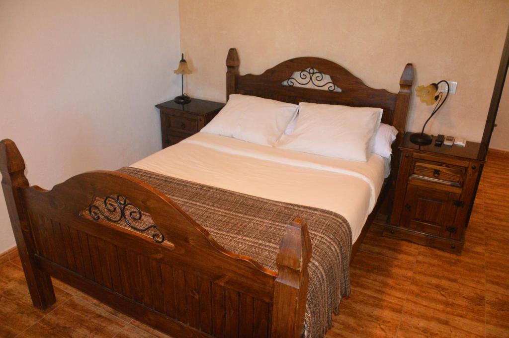Postel nebo postele na pokoji v ubytování Villa Carmela