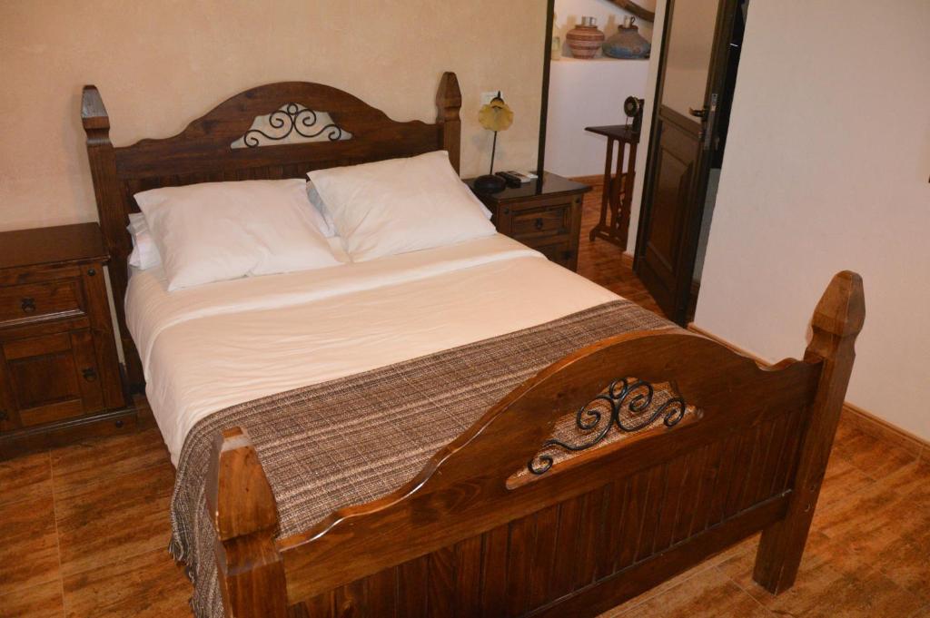 Postel nebo postele na pokoji v ubytování Villa Carmela