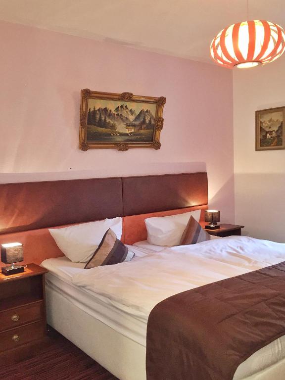 Postel nebo postele na pokoji v ubytování Hotel Attaché
