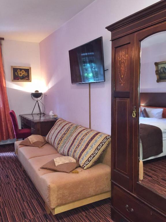 Postel nebo postele na pokoji v ubytování Hotel Attaché