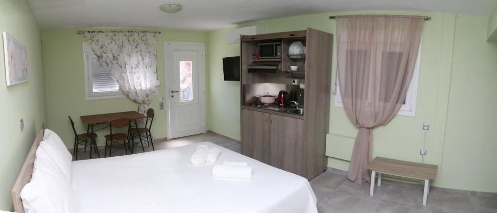 Postel nebo postele na pokoji v ubytování R&K Suites