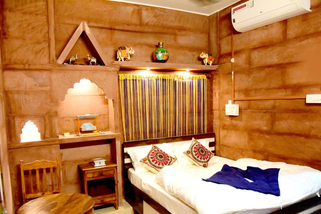 a bedroom with a bed in a room with wooden walls at MH Guest House in Jodhpur